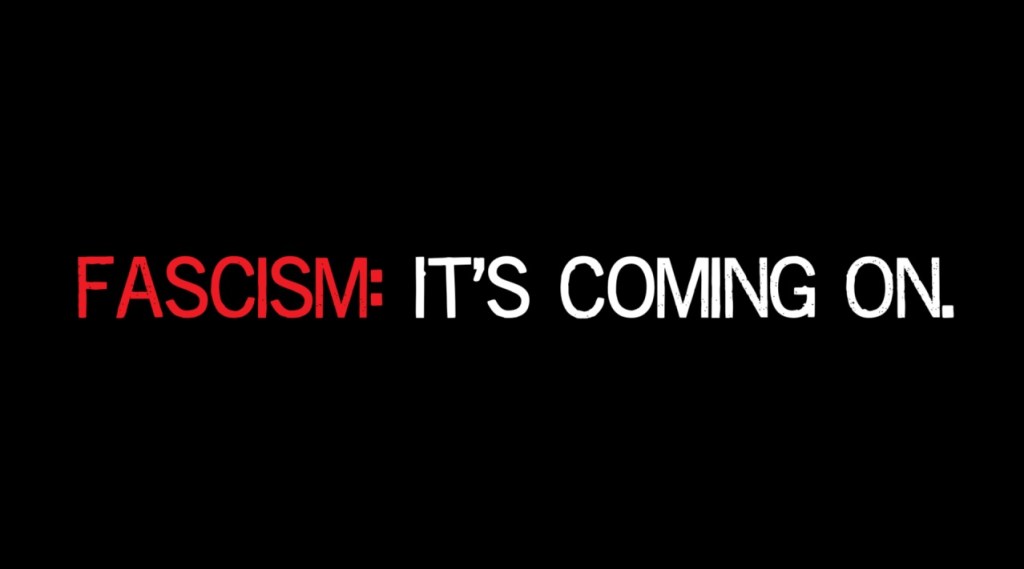 The words "Fascism: It's Coming On" in red and white text against a black background.